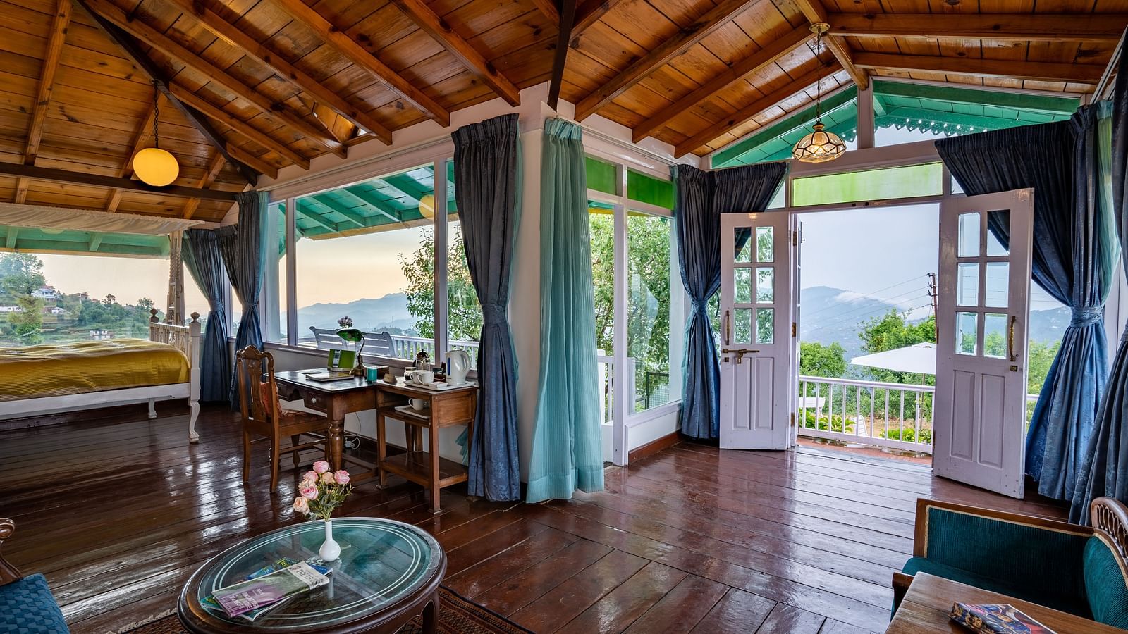 Indoor image covering the Wooden floors and long green curtains of Te Aroha.