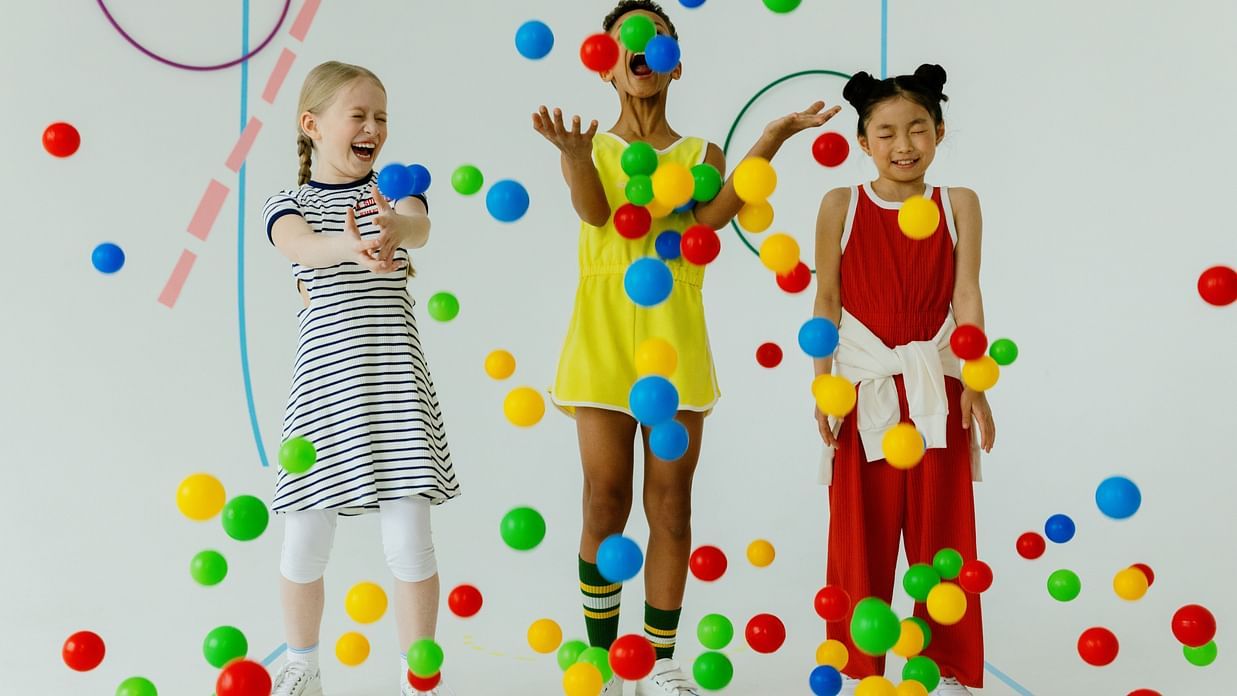 Kids playing with colour balls