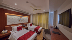 twin beds offered at the deluxe room facing the TV - Golden Tulip, Tirupati 
