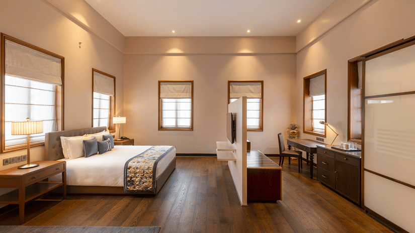 Premium Club Room with a bed, work desk and window view at Kenilworth Hotel, Kolkata.