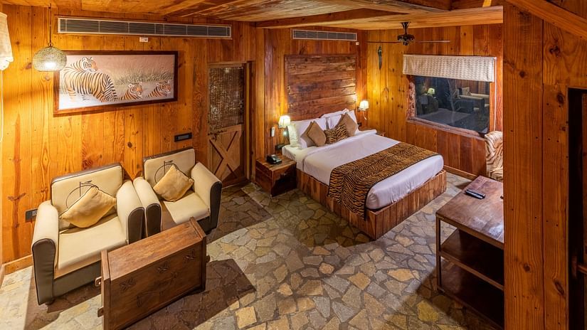 a duplex cottage in Ranthambore with a bed and a sitting area in the ground floor 1