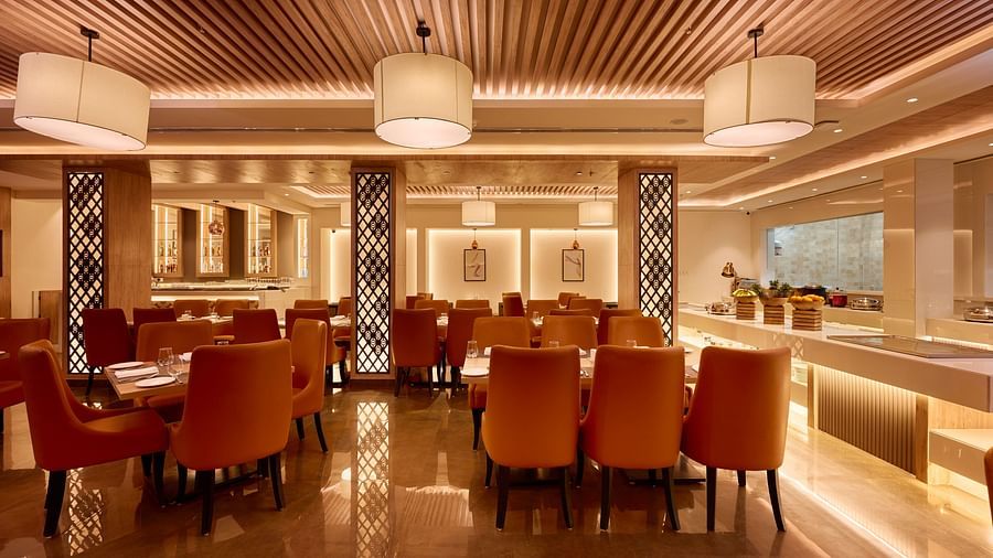 An image of our restaurant with ambient lighting and comfy seating arrangement
