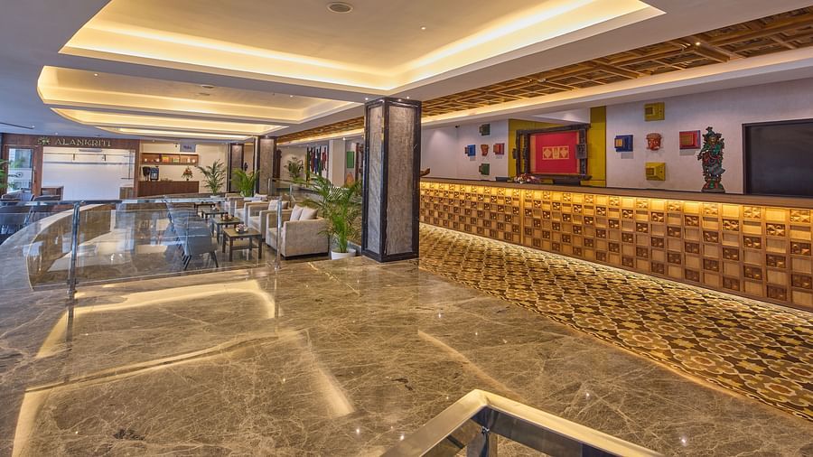 sofas in front of the reception desk at Grand Continent, Mahabalipuram