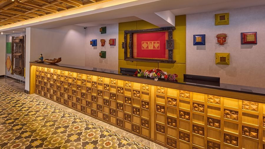 art pieces hanging behind the reception desk of Grand Continent, Mahabalipuram