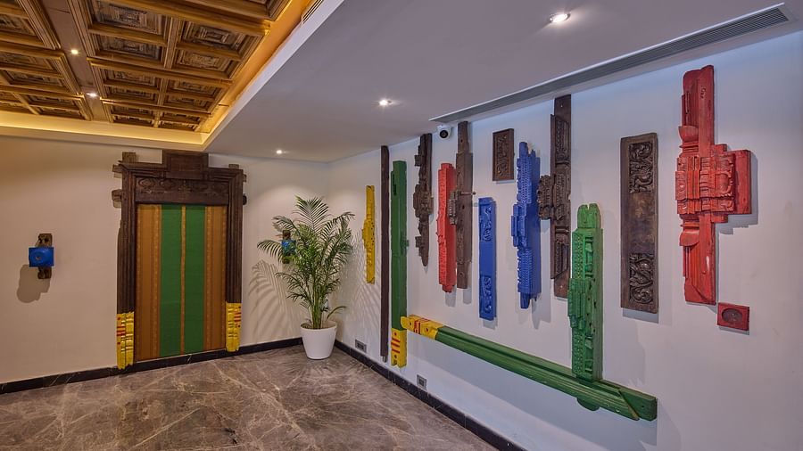 artwork and decor hanging on the walls of the lobby of our hotel - Grand Continent, Mahabalipuram