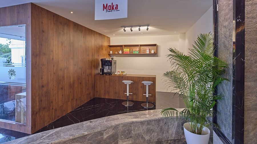 bar stools and a coffee machine at moka, our bakery in mahabalipuram - Grand Continent, Mahabalipuram