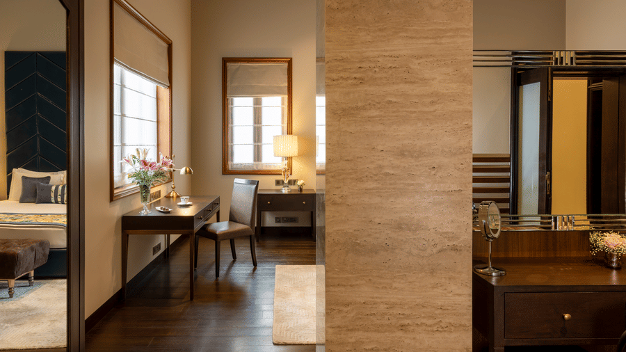 Presidential Suite dressing area with a vanity table and large mirror at Kenilworth Hotel, Kolkata.