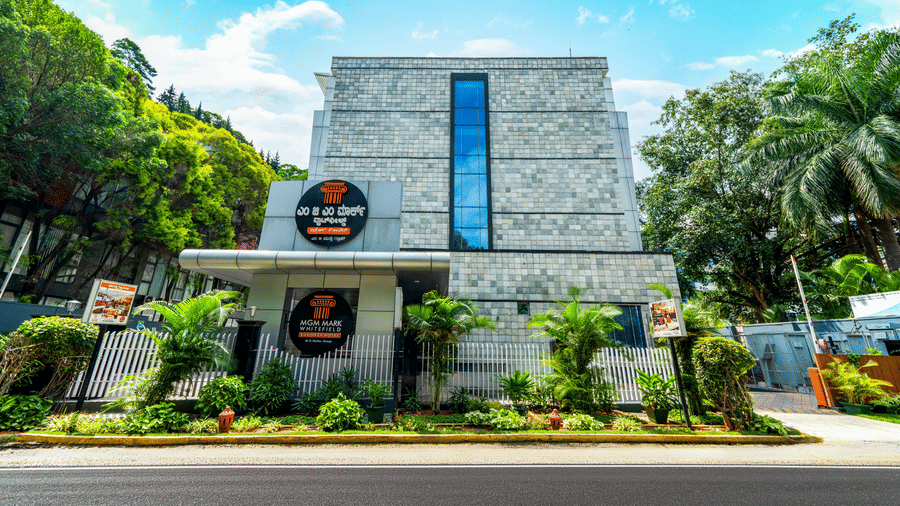 The building with mutliple windows and a singboard. | MGM Mark Whitefield