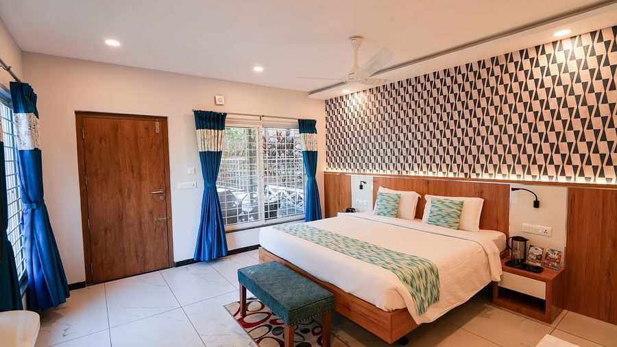 A spacious and inviting bedroom with a large bed and elegant decor -  MGM Whispering Wind's Resorts