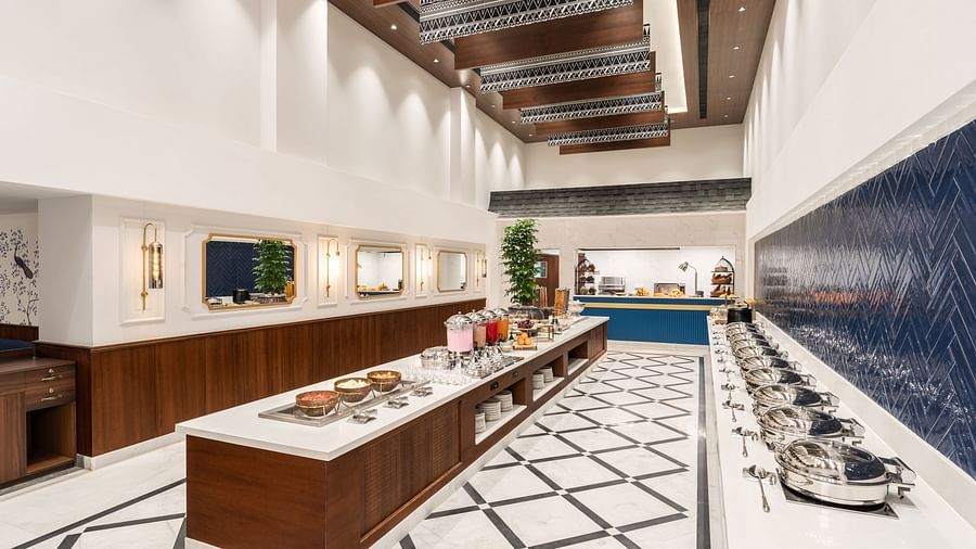 An image of the buffet area at our hotel in Haridwar, set in a brightly illuminated space - MJ Sarovar Portico, Haridwar