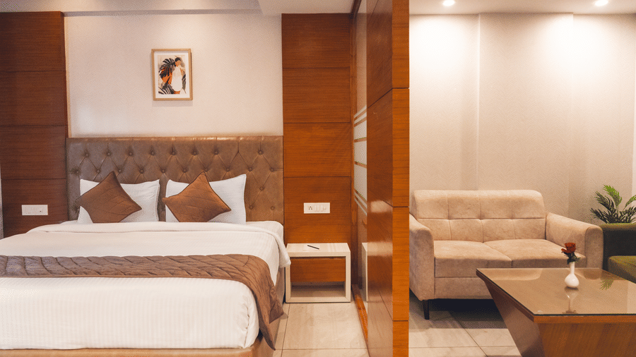 A large bed of a Super Deluxe Room at Montclair Ananta, Elite