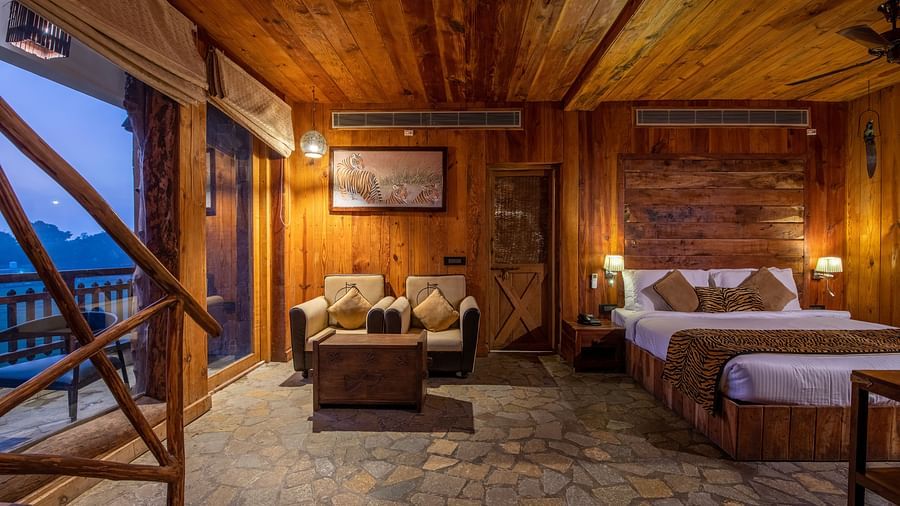 view of a bed and a sofa set offered by one of the cottages in Ranthambore