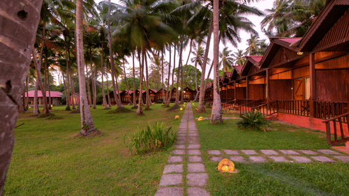 a row of cottages and the lawn at Sea Princess Beach Resort, Port Blair