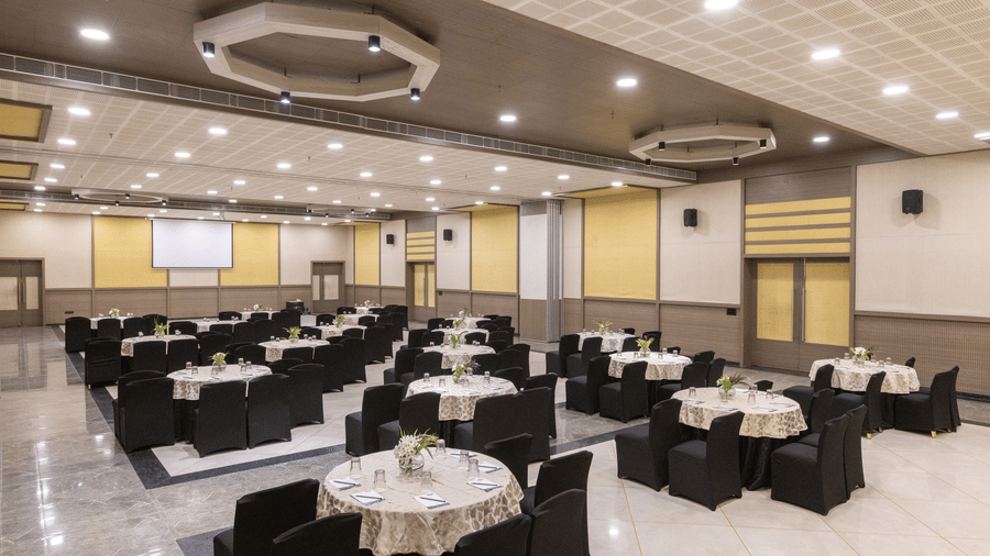 Hive indoor conference hall with projector and seating at The Golden Tusk, Jim Corbett