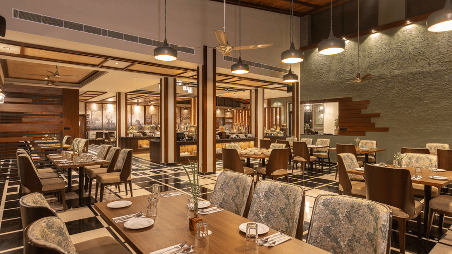 A fine dining restaurant setup with elegant seating at The Golden Tusk, Jim Corbett.