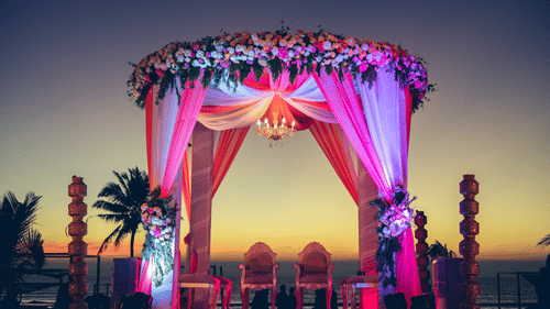 View of Palm Lawn with lights on during sunset for finest wedding venues in south goa