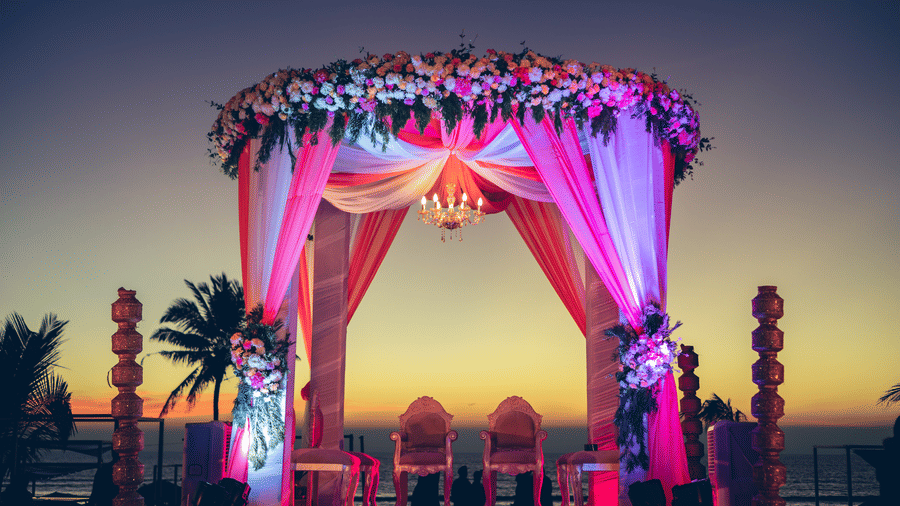 View of Palm Lawn with lights on during sunset for finest wedding venues in south goa