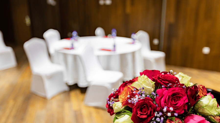 A close up shot of a bouquet with a table and chairs in the background - Ramada by Wyndham Addis, Addis Ababa.