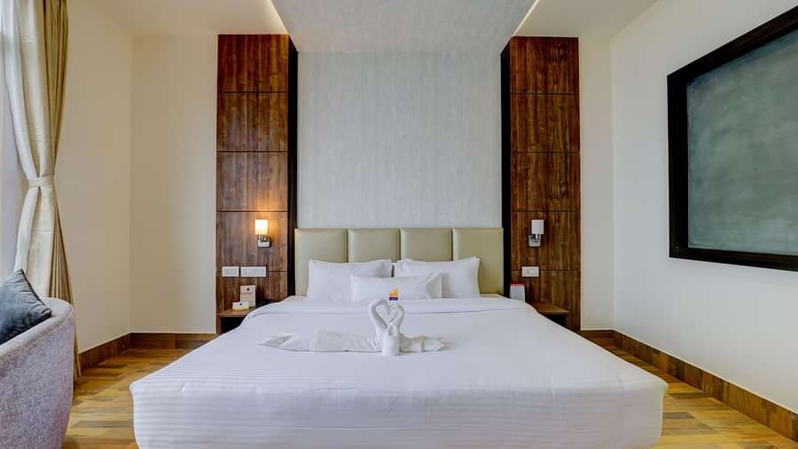 view of king size bed and TV of a Deluxe Room Banari Regency by Summit, Namchi