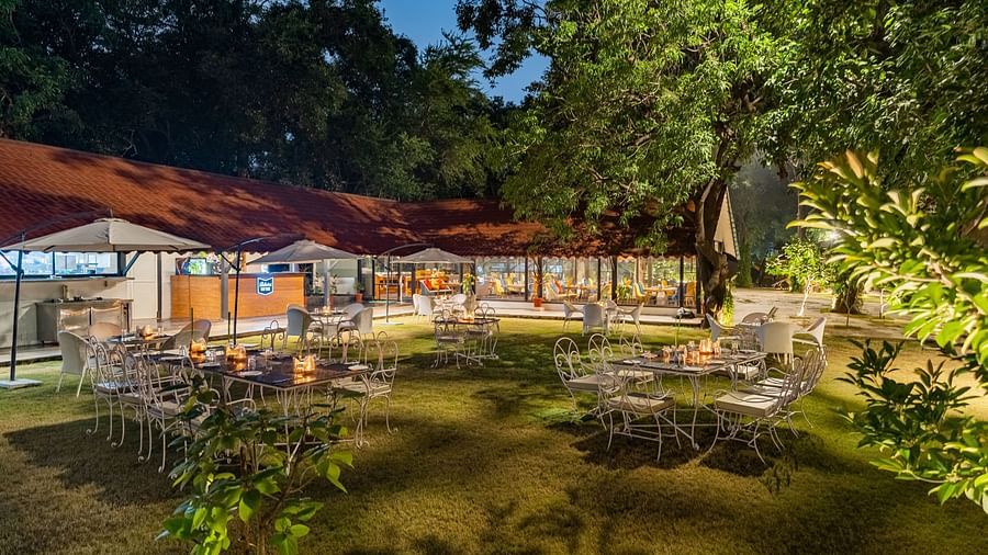 image of the outdoor setting of the dining area at the aranya vilas in udaipur