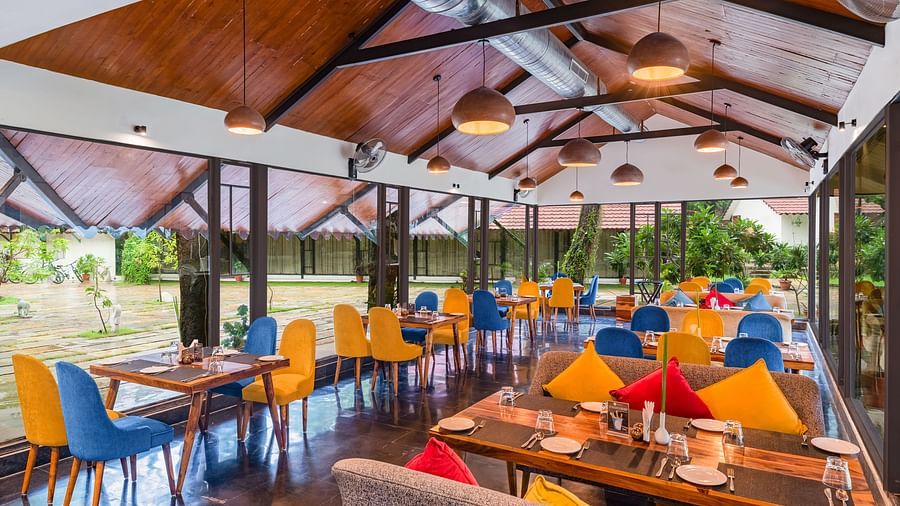 image featuring the full view of Kalptaru with nicely arranged chairs and tables for a multi-cuisne dining experience at aranya vilas in udaipur 