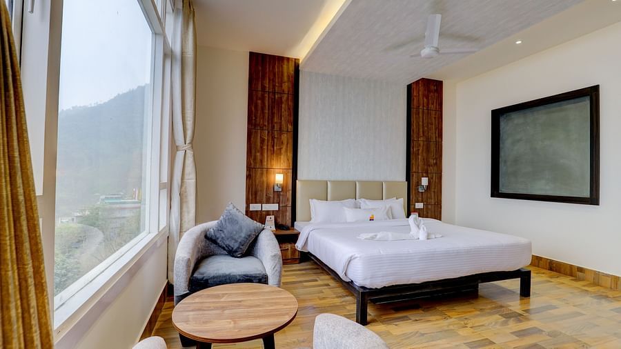 view of king size bed and TV of a Deluxe Room Banari Regency by Summit, Namchi