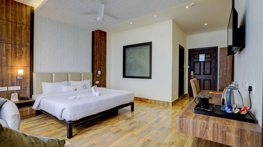 view of king size bed and TV of a Deluxe Room Banari Regency by Summit, Namchi
