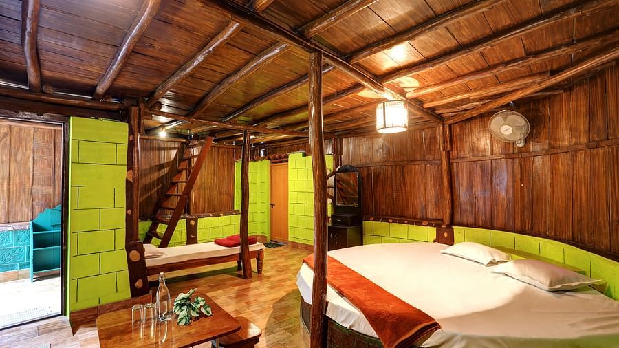 Spacious wooden bedroom with lime green accents and a staircase - Evergreen County