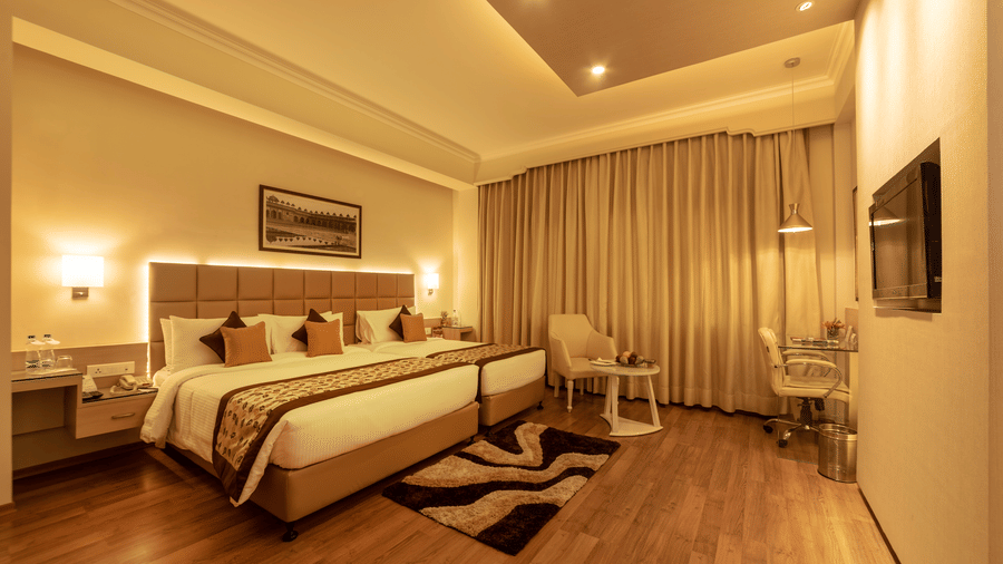 An overview of Shiraz Premium Room with a double bed and a television inside Clarks Shiraz, Agra - A 5-Star Hotel in Agra Near Taj Mahal