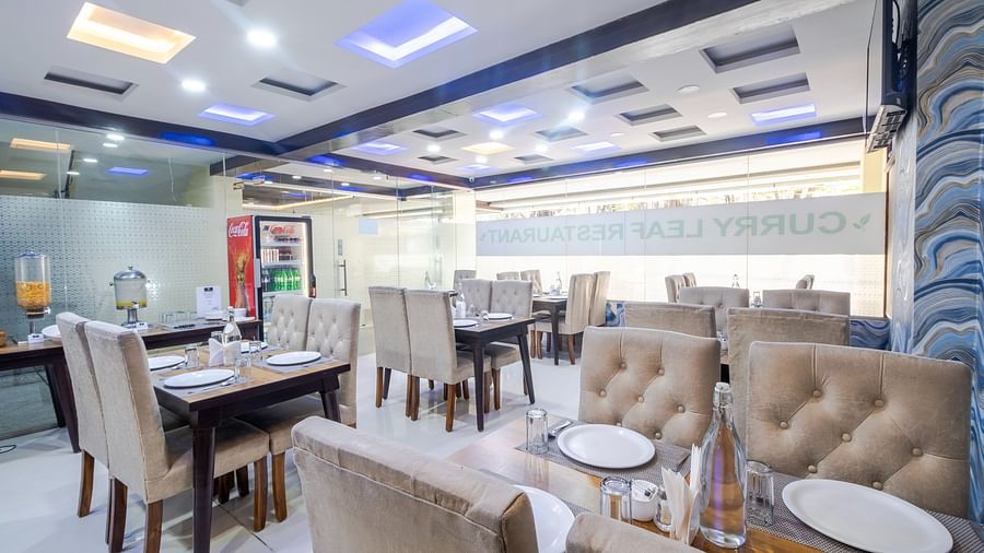 Dining tables arranged in the restaurant at Lemonridge Hotels