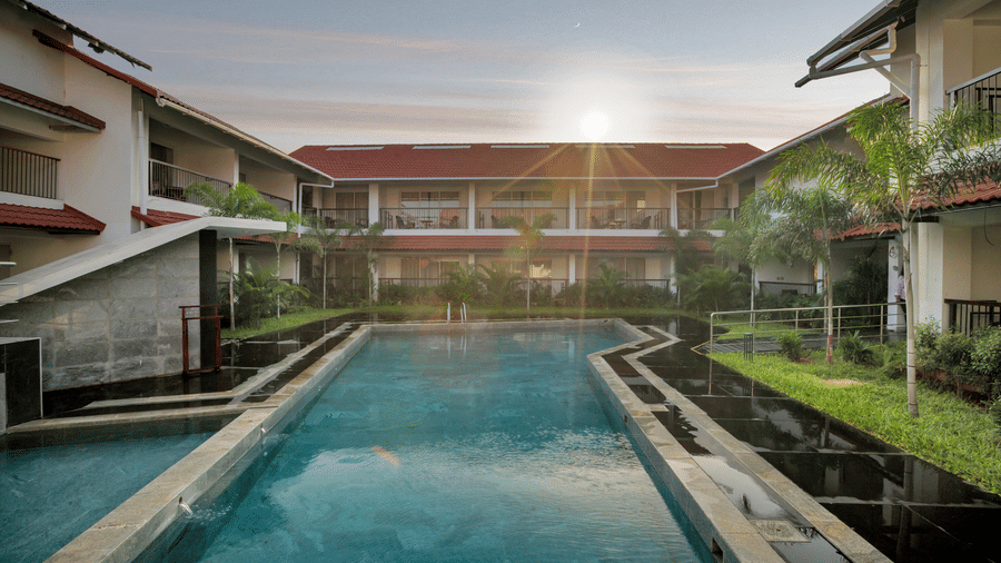 View of the swimming pool and courtyard at Mango Hill, Velankanni.