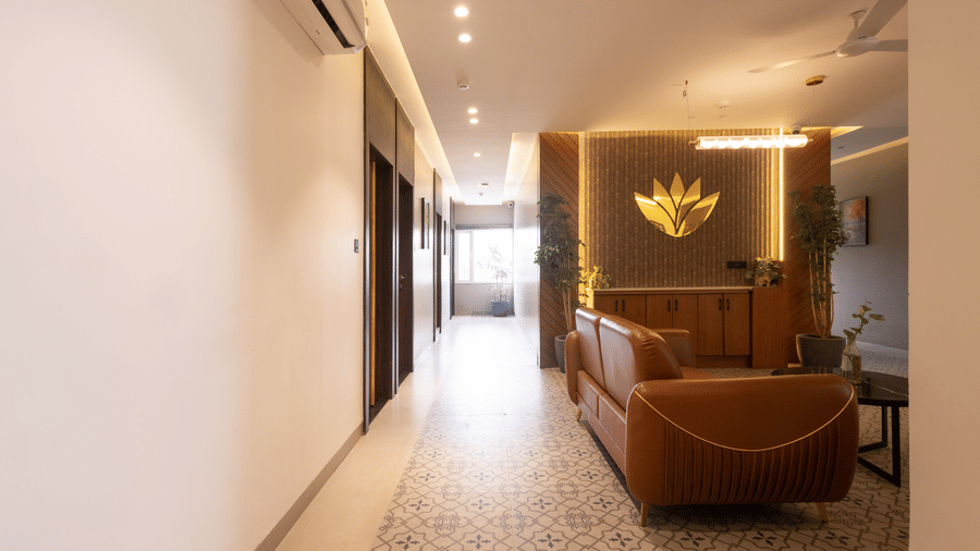 Interior view of a hallway leading to a seating area at Pravasa Stay Luv Kush, Indore.