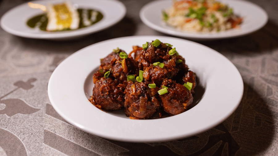 Close-up view of a plate of food, possibly a main course, at Pravasa Stay Luv Kush, Indore.