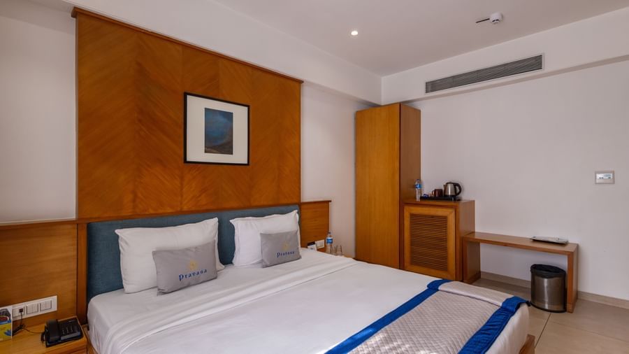 Side view of the queen size bed seen in the Executive Premium Room of Pravasa Stay Vijay Nagar, Indore.