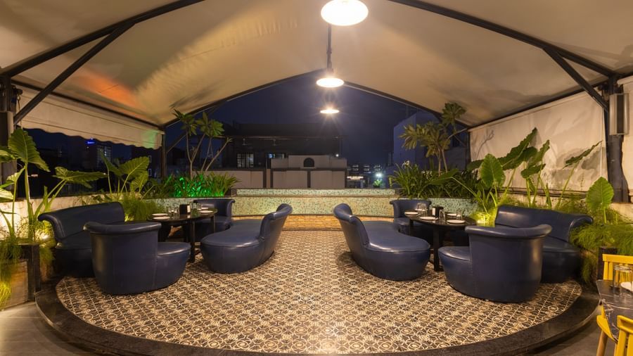 Rooftop dining setup in the Pravasa Cafe at Pravasa Stay Vijay Nagar, Indore.