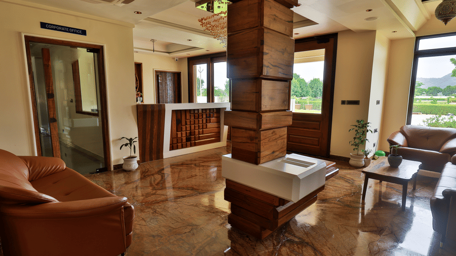 The main entrance and reception area of the resort, showcasing polished floors and modern architectural pillars - Tathastu Chavri Resort, Jawai