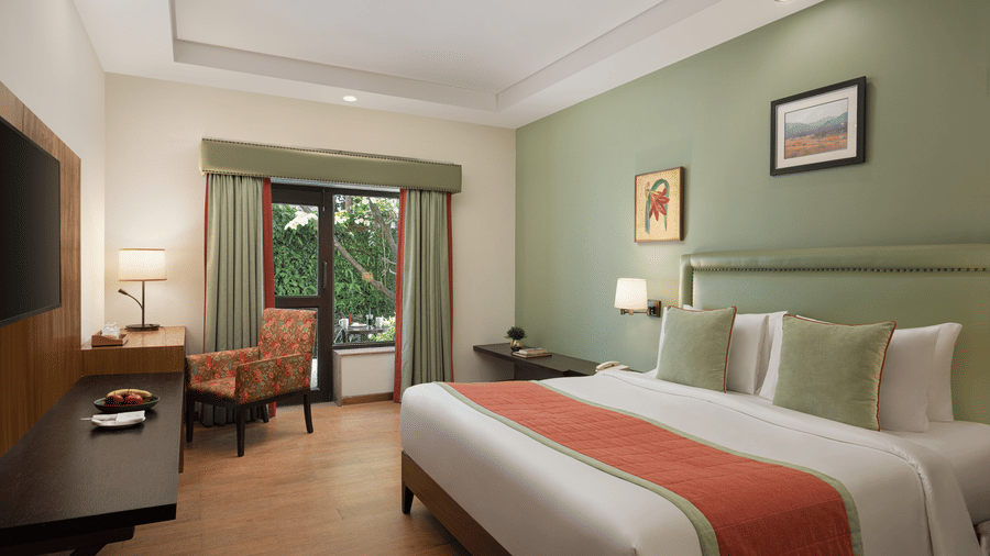 Comfortable bedroom at The Riverview Retreat Corbett with cosy bedding warm lighting and elegant interiors