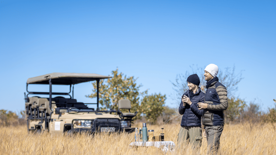 Safari guide preparing for a game drive in Kalahari grasslands at Evolve Back Kalahari