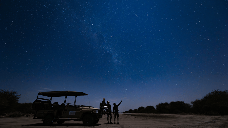 Night game drive under a starry Kalahari sky at Evolve Back Kalahari