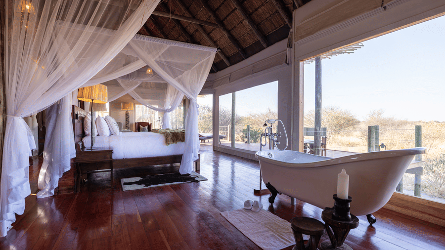 Freestanding bathtub inside a spacious tented suite at Evolve Back Kalahari
