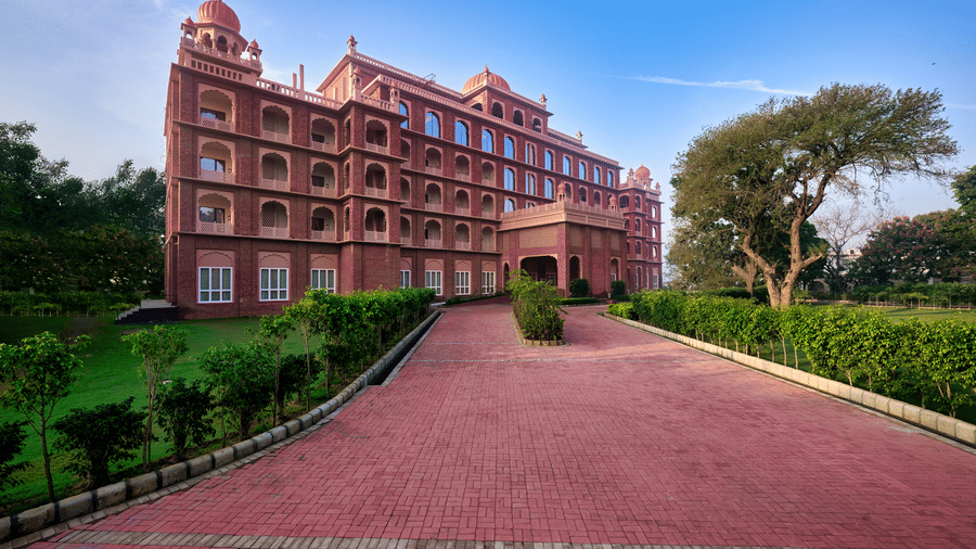 The pathway leading to our hotel in Amristar surrounded by trees - Sarovar Premiere Amritsar