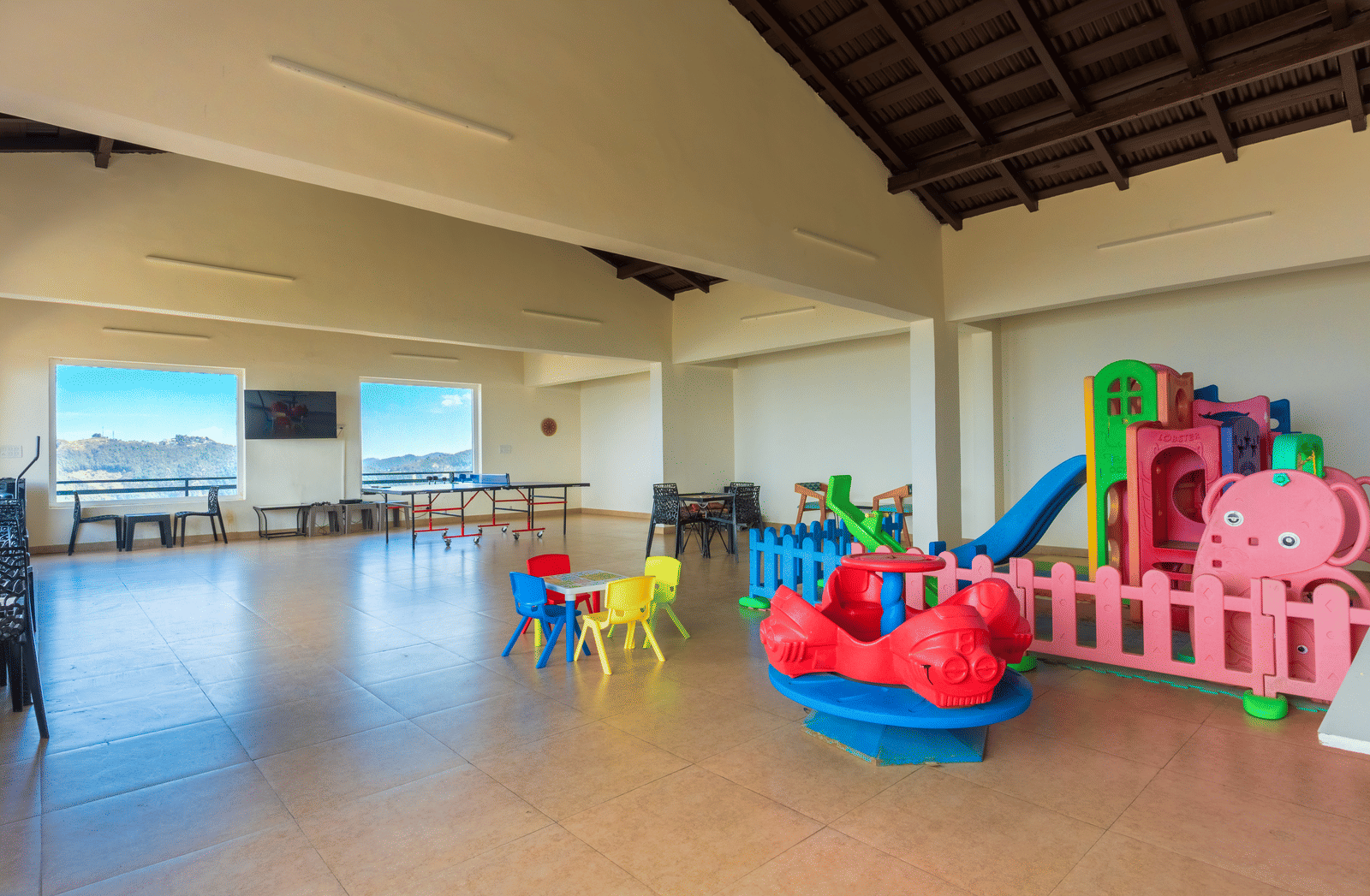 A dedicated and safe indoor play space for children with colourful toys at Himalayas Resort By The Lake Hill, Mukteshwar.