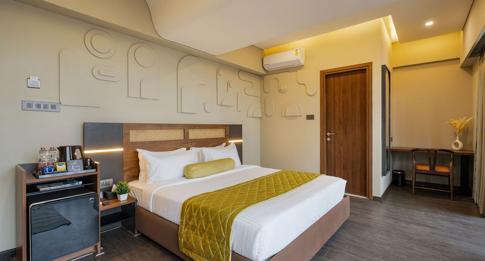 Citrus Room at Fressotel, Kanakapura Road, with a 240 sq. ft. space, air-conditioning, and a 40-inch Android TV.