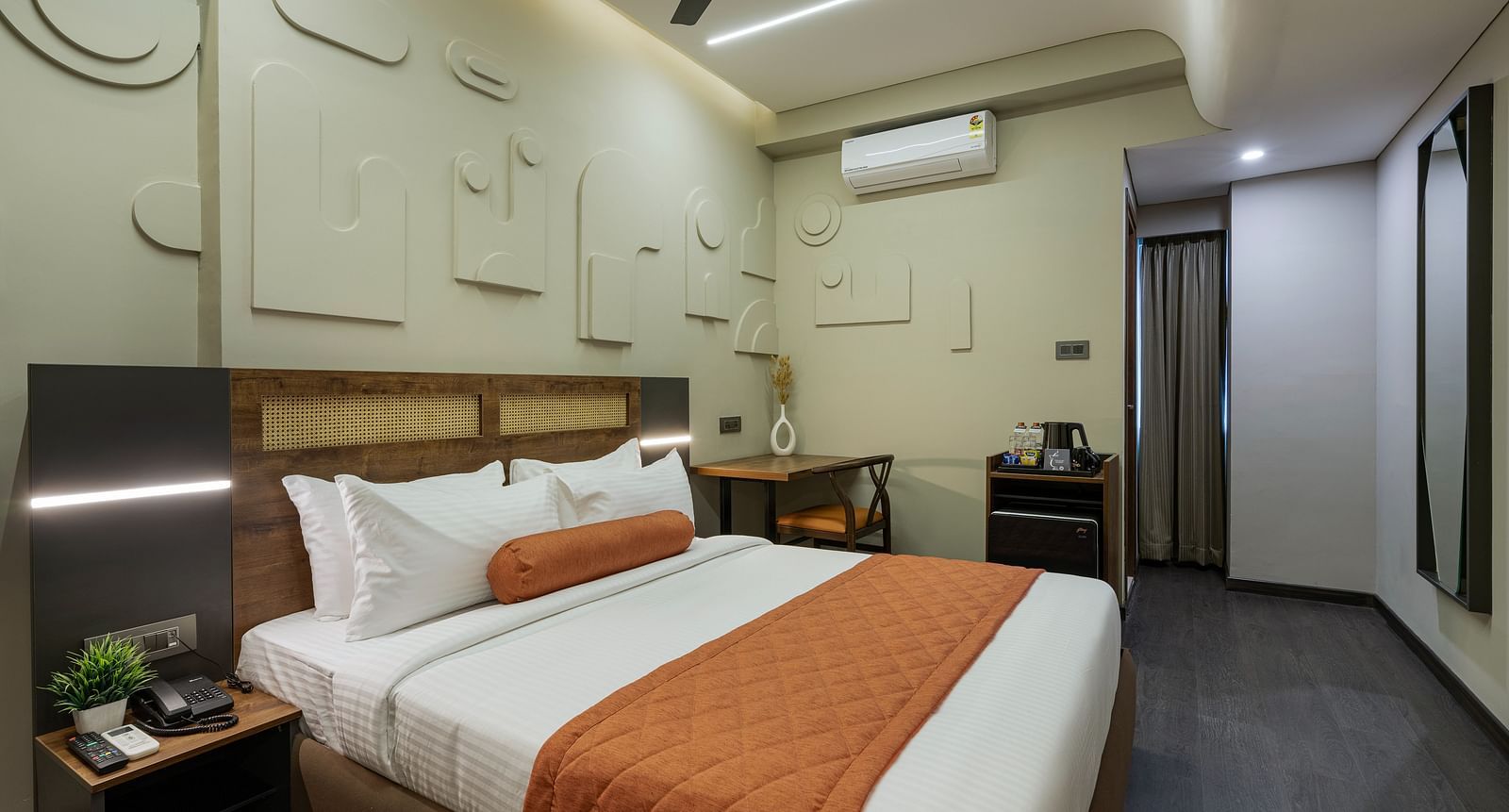 Elegant Tangerine Room offering modern amenities in a tranquil setting at Fressotel, Kanakapura Road.