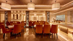 An image of our restaurant with ambient lighting and comfy seating arrangement