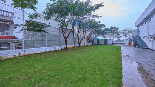 the outdoor event venue at Grand Continent, Mahabalipuram flanked by buildings