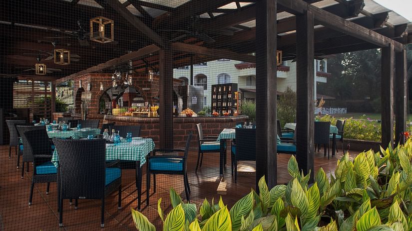 Our Italian restaurant in South Goa, Salute, looks welcoming with its outdoor seating facility and  lush furnishing