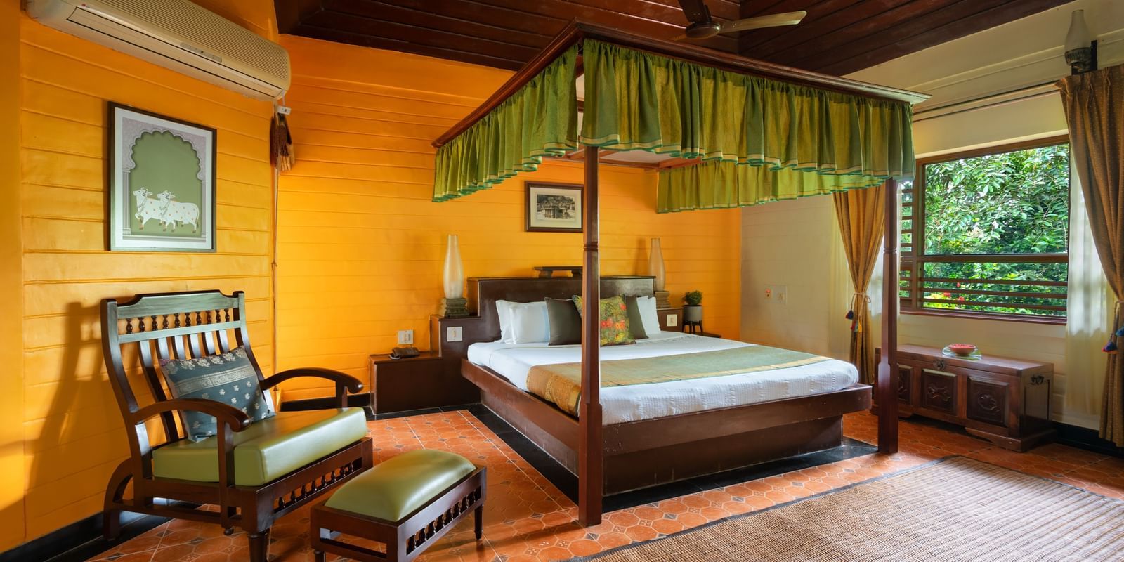 image of a bedroom at malnad palace suite at hoysala village resort, Hassan
