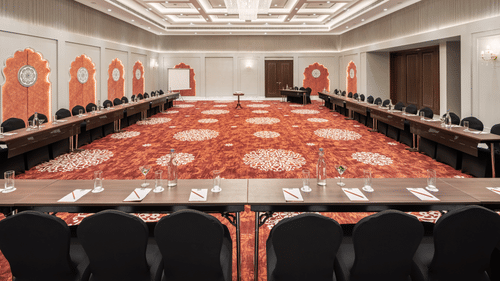 An image of pur banquet hall in Haridwar with a u-shaped seating arrangement - MJ Sarovar Portico, Haridwar