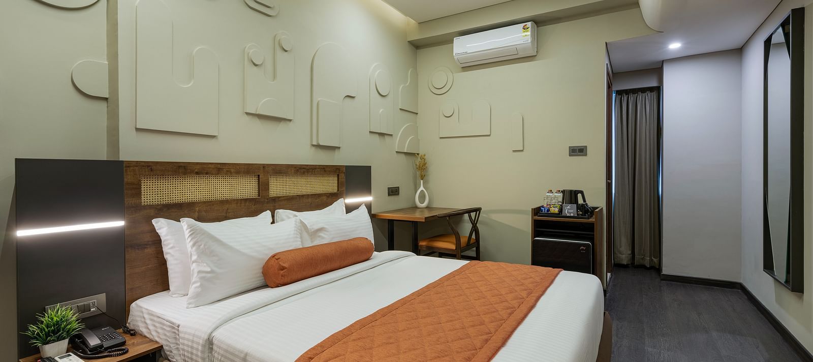 Elegant Tangerine Room offering modern amenities in a tranquil setting at Fressotel, Kanakapura Road.